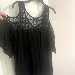 Black dress blouse. Loose fitting. Shoulder open.
